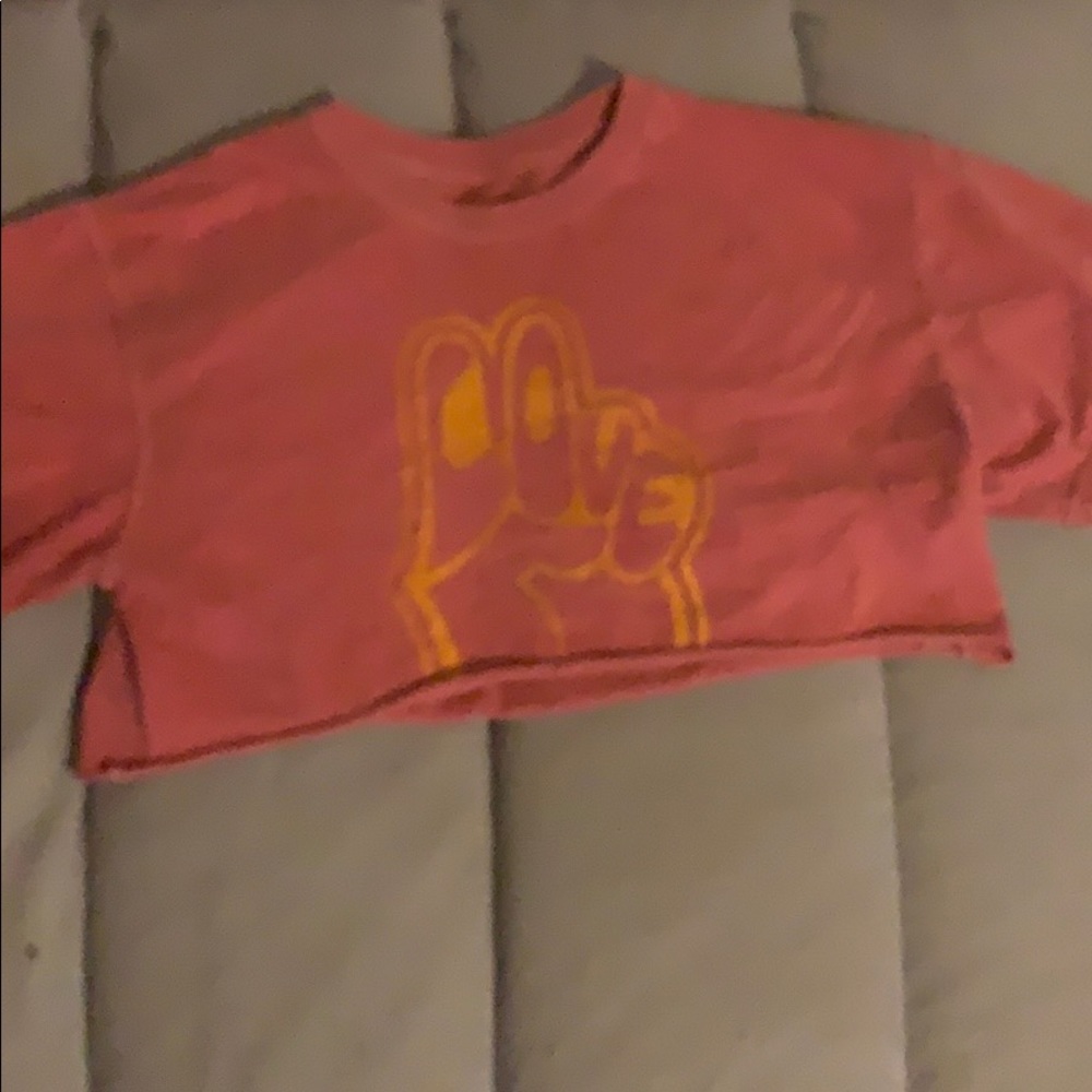 a cropped shirt with a peace sign on it.